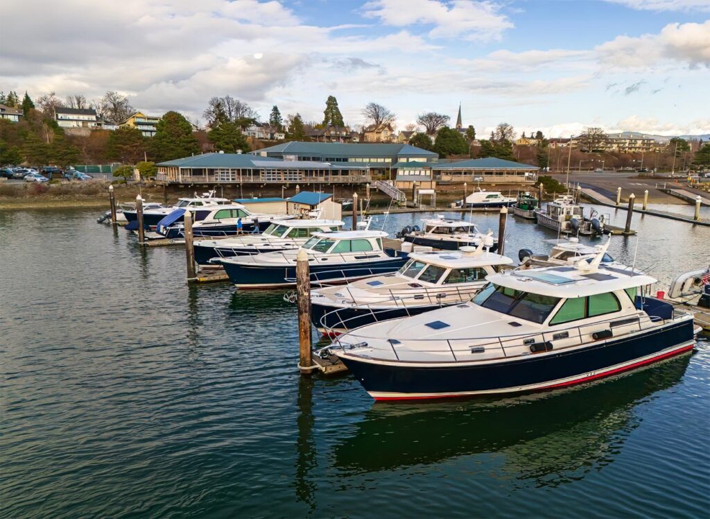 The docks and launch ramp at Bellingham Yachts with several Sabre and Back Cove Yachts in the slips.