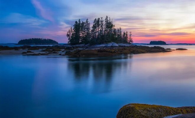 Sunset, calm water and the islands on the Maine Island Trail
