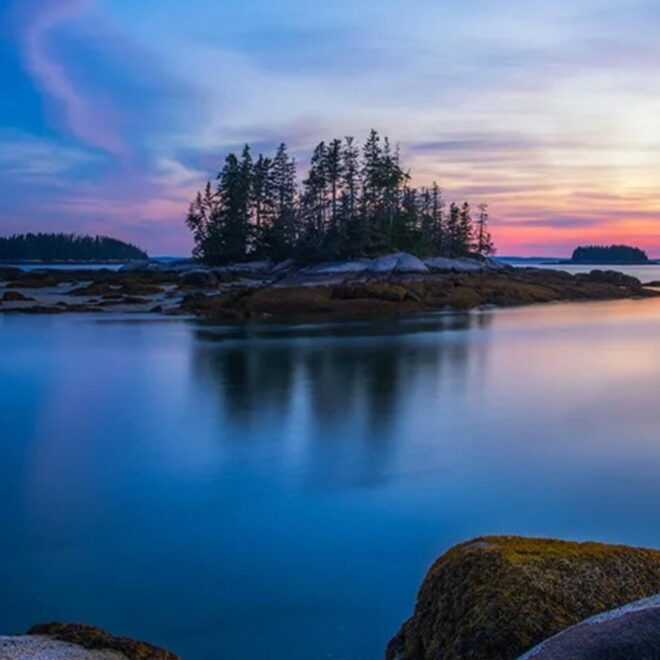 Sunset, calm water and the islands on the Maine Island Trail