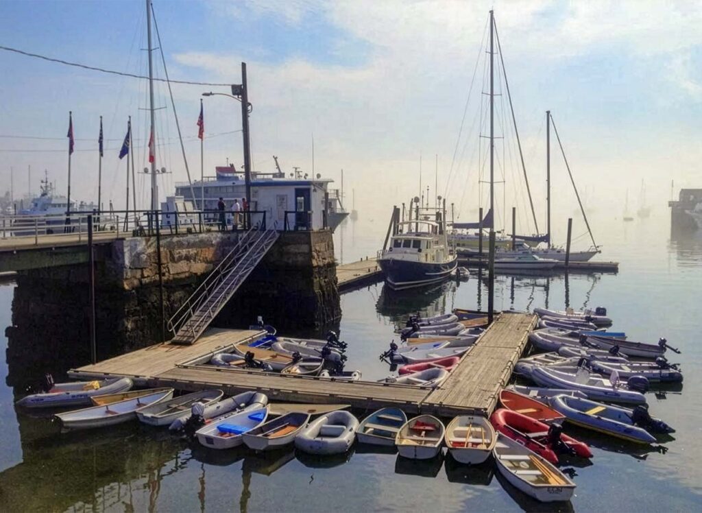 A foggy morning in Rockland Harbor, Maine Harbormaster office and dinghy dock.