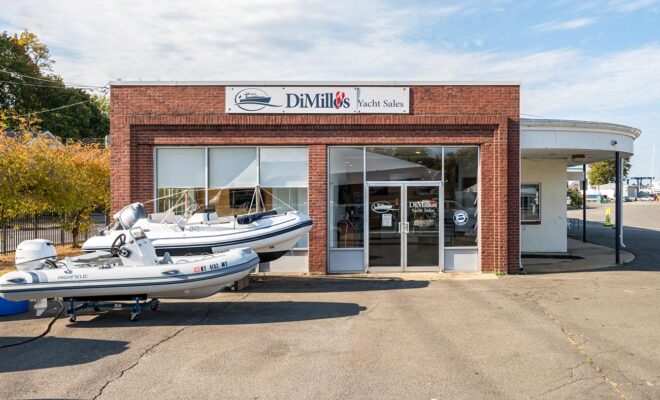 DiMillo's Yacht Sales office and two RIBs in the parking lot.