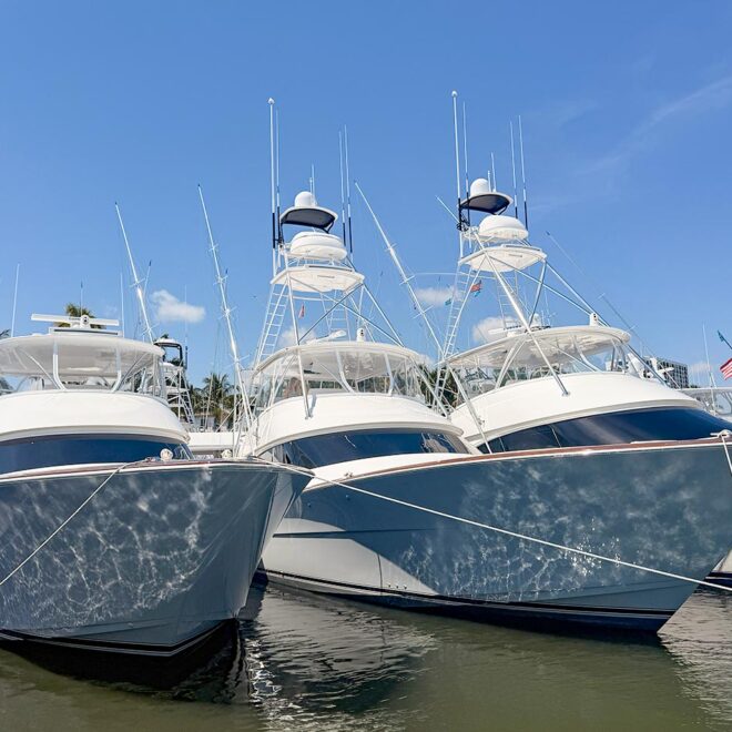 Three sport fishing boats tied up at a boat show