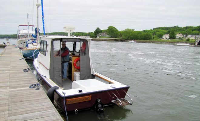 Photographer and boat-owner Al Trescot prepares BLONDIE for our journey down the Damariscotta River.