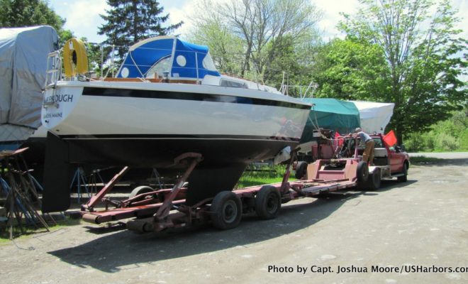 After a soggy spring and some late nights, TIME ENOUGH is loaded on the trailer for the short journey from Camden to Rockport.
