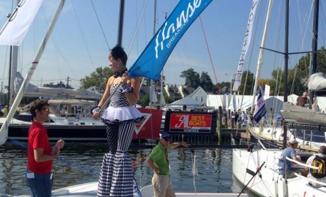 Exhibitors pull out all the stops to attract attention at boat shows. I hope that Hanse Yachts paid this stilts-walker well!
