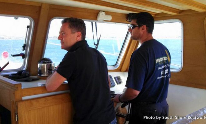 TWIST's new owner, at left, on a sea trial.