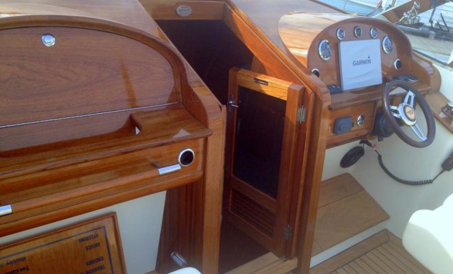 The Hinckley Company hasn't lost its roots in Maine wooden boat craftsmanship, as shown by the dashboard and trim.