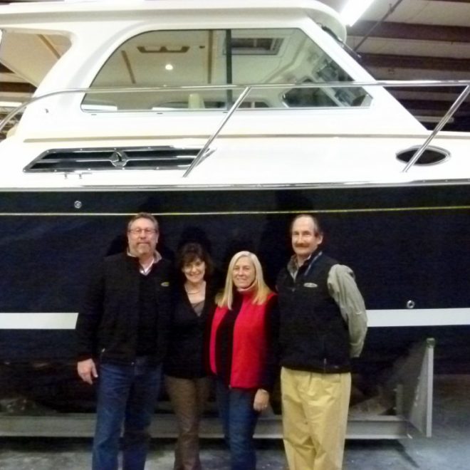The team from Boston Yacht Sales in front of Hull No. 500. This same crew took delivery of Hull No. 1!