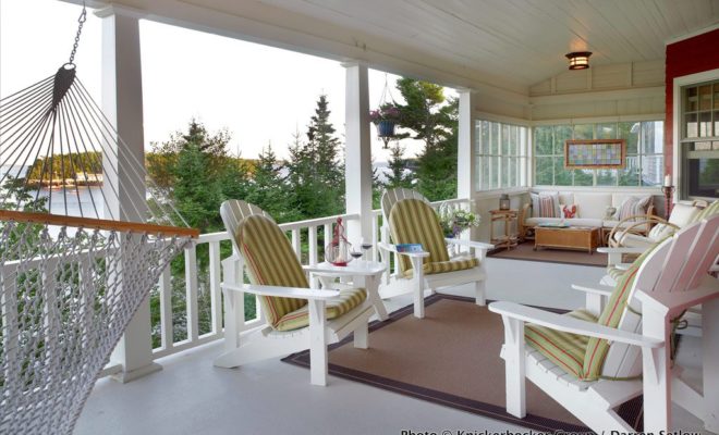 The deck on this vacation retreat invites long afternoons spent curled up on a wicker chair with a good book.