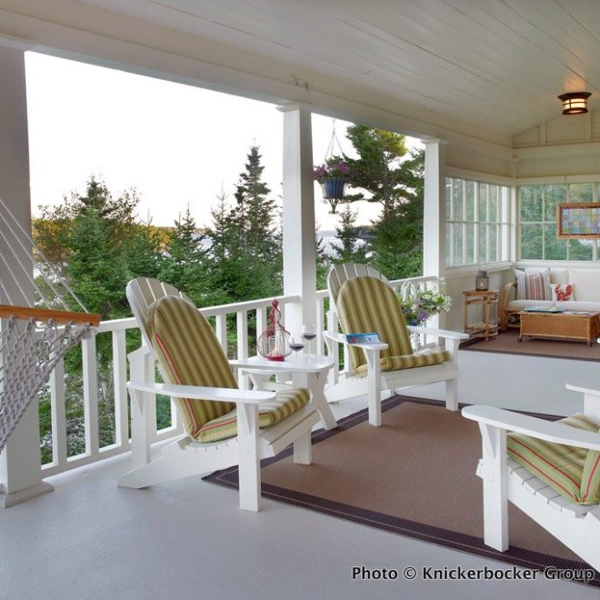 The deck on this vacation retreat invites long afternoons spent curled up on a wicker chair with a good book.