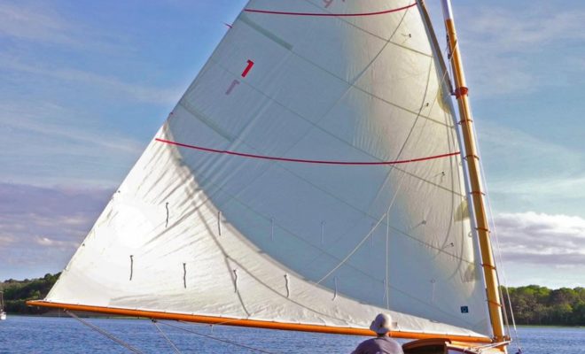 CARACAL, a classic catboat built by Arey's Pond Boat Yard, under sail at the 2014 APBY Cat Gathering.