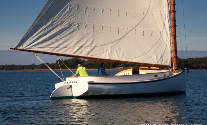 Frededrick Villars, owner of CONJURER (in yellow), and Tony Davis, owner of Arey's Pond Boat Yard, sailing on Oct. 15, 2013.