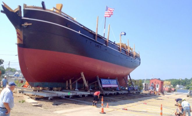 Crews labor to move the massive CHARLES W. MORGAN onto the shiplift that will lower it into the water on July 21.