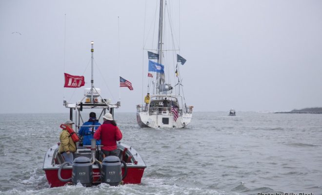 A fleet of boats accompany KIWI SPIRIT on its way out of St. Augustine and out to open water.