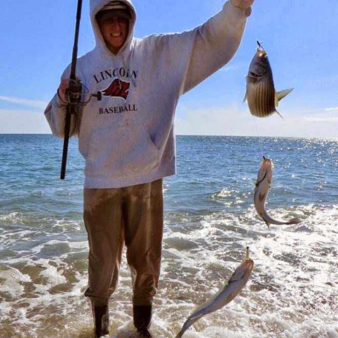 Jon Pickering hoists up a triple header that was landed on shrimp fly teasers and a Cocahoe on a jighead.