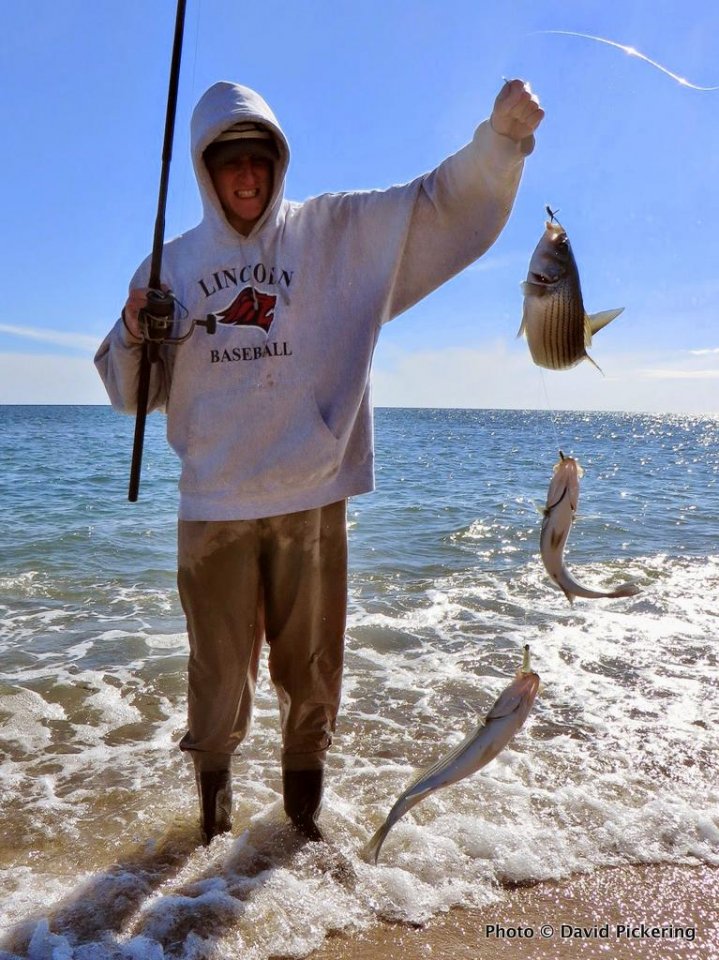 Jon Pickering hoists up a triple header that was landed on shrimp fly teasers and a Cocahoe on a jighead.