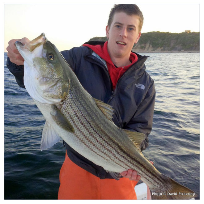 My son Ben with a nice keeper striper that he landed off Block Island.