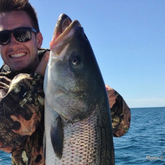 The smile on this fisherman's face says it all: This summer, those who fish from a boat are winning!