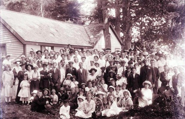 Charles Coombs photographed the Morrill Sunday School visiting his cottage "Ten Oaks," on Tilden Pond in Belmont, in August 1917