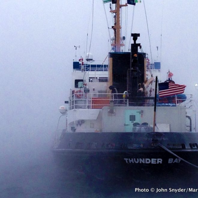 The Coast Guard icebreaker THUNDER BAY sits amid the sea smoke at Tilson's Wharf in Rockland.