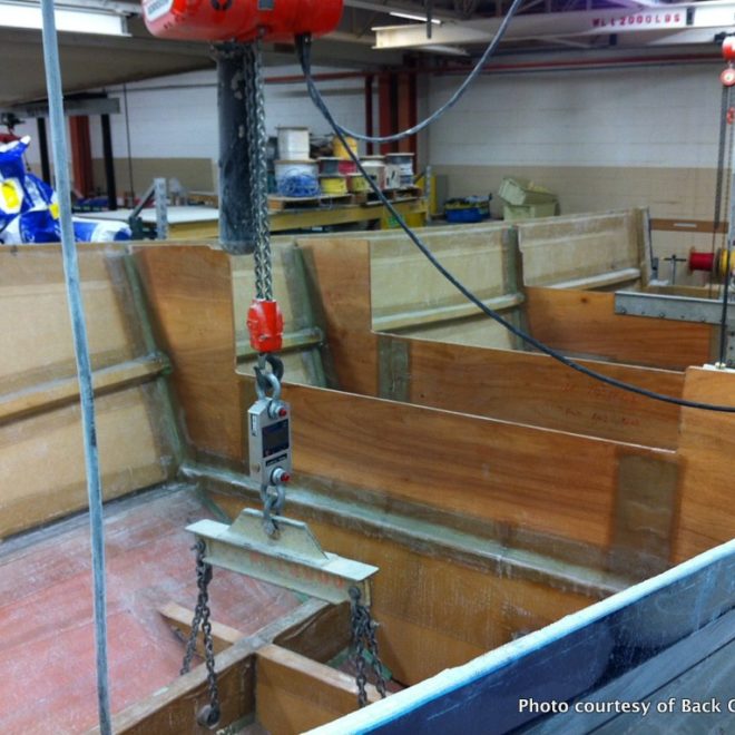 Two scales are used to weigh the 37-foot Back Cove Downeast 37 hull.