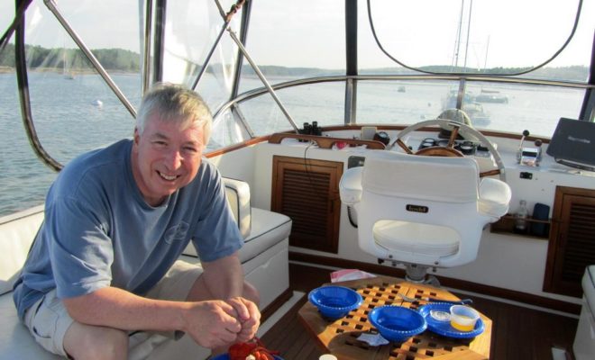 Vic Thuotte, a 31-year Air Force veteran and Yankee Marina and Boatyard customer, enjoys the flybridge of CONTRAILS.