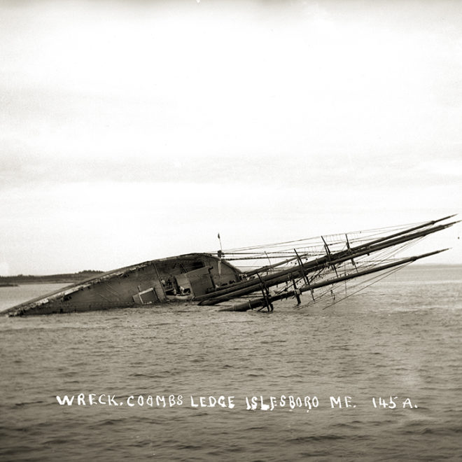 The ALICE E. CLARK, built in 1898, soon after her demise off eastern Islesboro, July 1st, 1909. Note the dinghy at center.