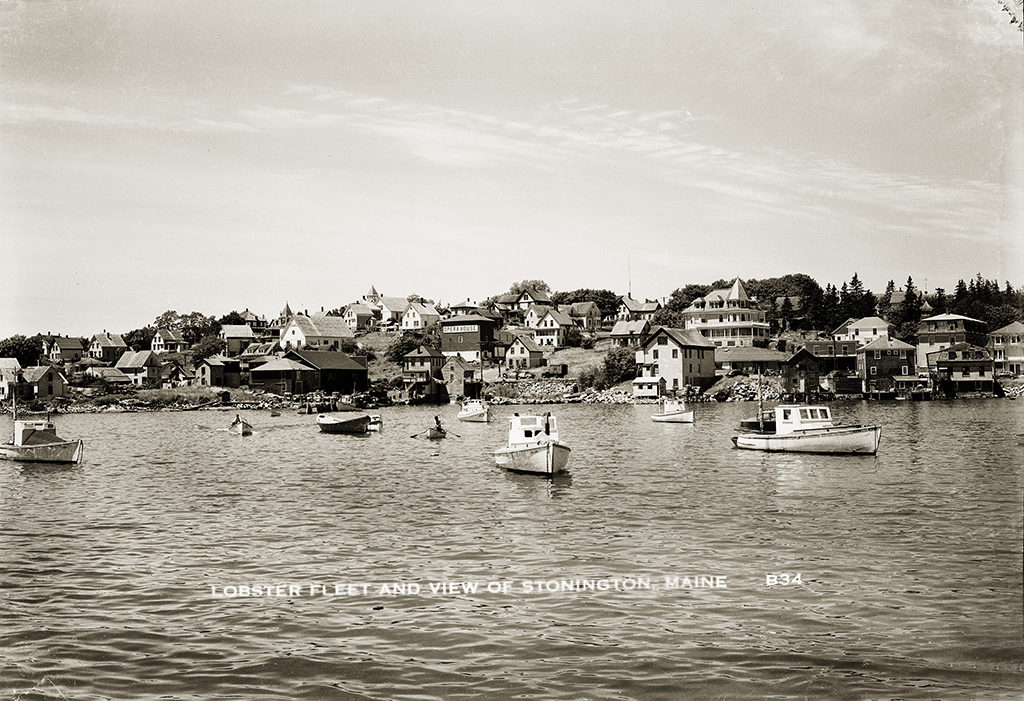 Lobster Boats in Stonington Harbor, unknown date. The opera house, still a fixture in Stonington today, is at center.