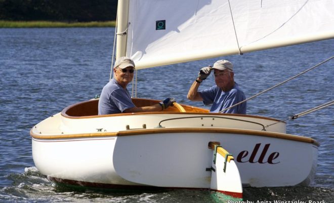 ELLE, a 16' Open Lynx owned by Phil Dickinson, on left, finished first in her class. Captained by Dick Lovis, at right.