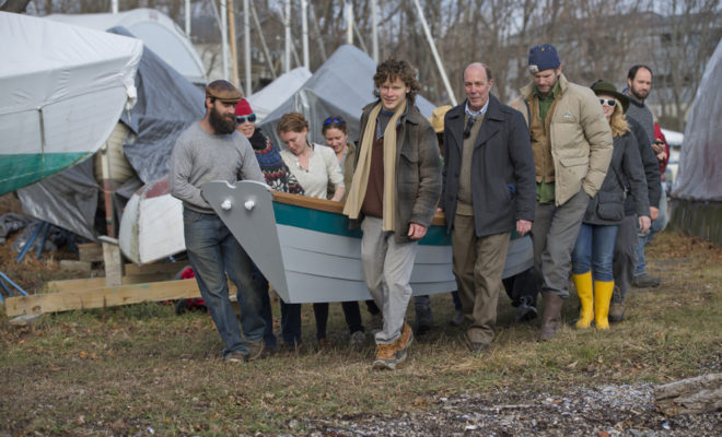 Friends carry the new Grand Banks dory to the harbor for launch.