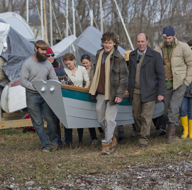 Friends carry the new Grand Banks dory to the harbor for launch.