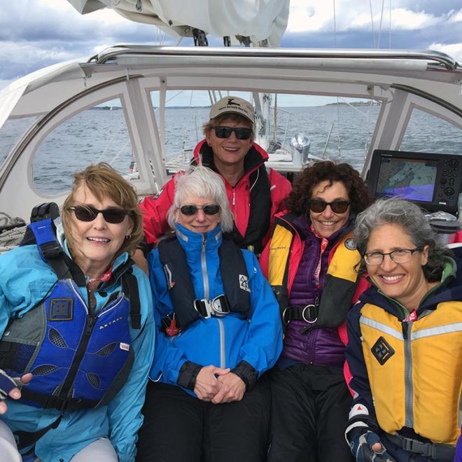 Women get hands-on sail reefing experience at the NWSA Women’s Sailing Conference.