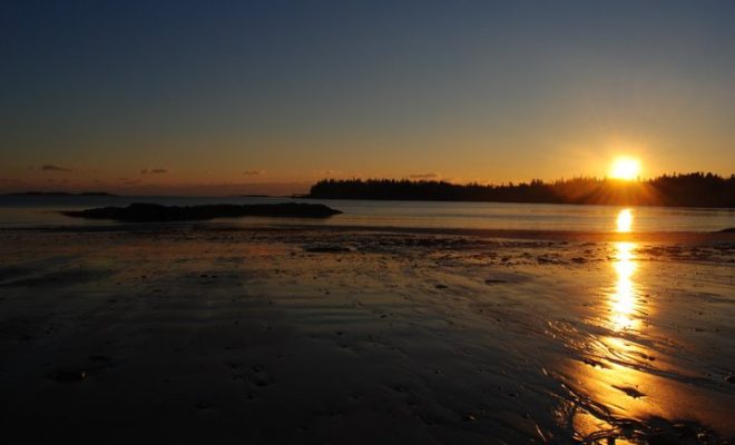 Sunset over the smooth sands of Drift Inn Beach, in Port Clyde.