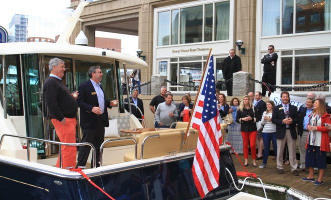 Bentley Collins, VP of Marketing and Sales, and Michael Myers, of Boston Yacht Sales, welcome guests.