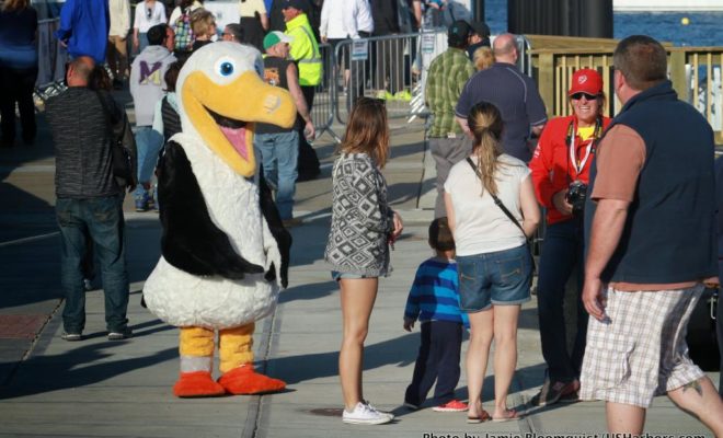 Wisdom the Albatross, the Volvo Ocean Race's mascot, is on hand to greet some young visitors.