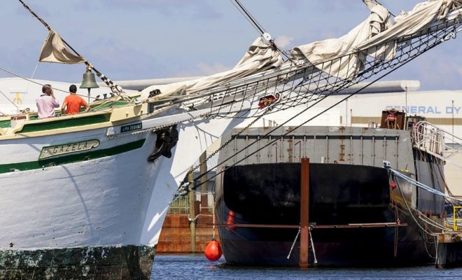 The 177-foot tall ship GAZELA with the hull of the SSV OLIVER HAZARD PERRY in the background.