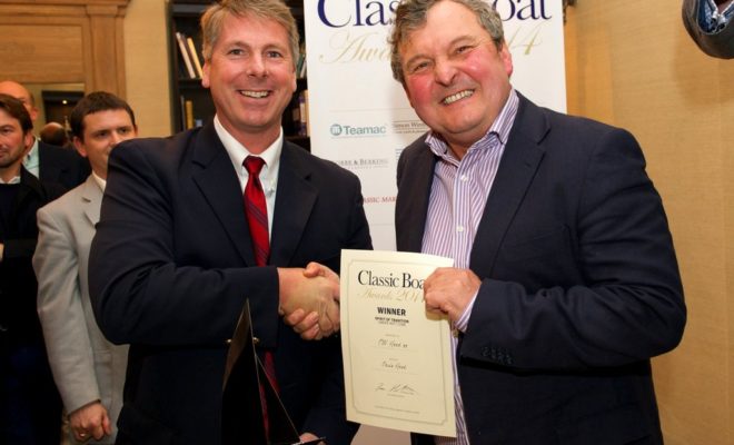 Chris Hood accepts the award in London from the BBC's Mark Horton.