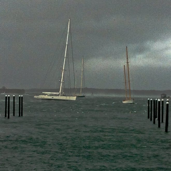ARTEMIS stands up to a gust in Newport Harbor during Hurricane Sandy. WHITEHAWK is in the foreground and REBECCA just astern.