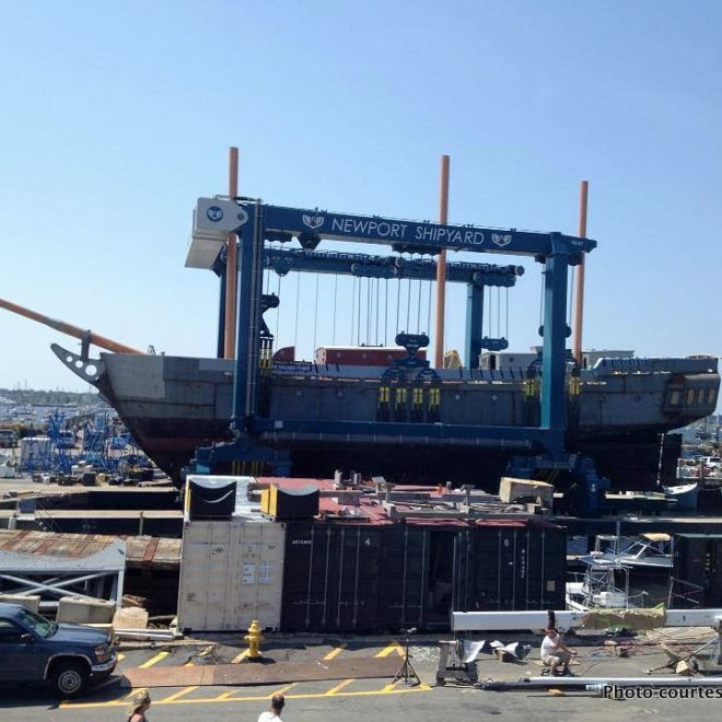 A massive Travelift is required to haul OLIVER HAZARD PERRY out at Newport Shipyard.