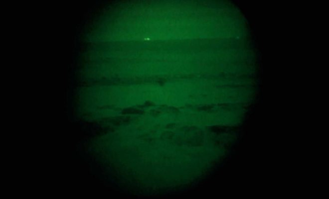 A look through the night vision binoculars on a cold island night.