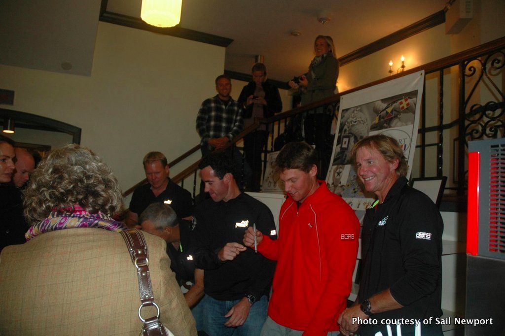 Members of the Puma Ocean Racing team sign posters at a "Sail Newport Presents" event last fall.