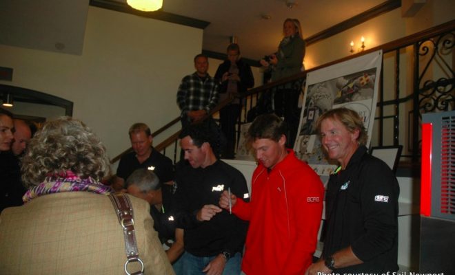 Members of the Puma Ocean Racing team sign posters at a "Sail Newport Presents" event last fall.