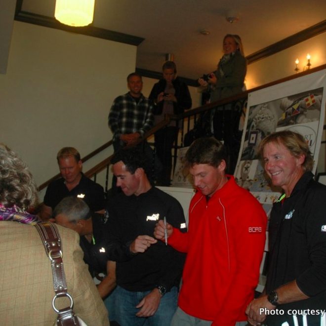 Members of the Puma Ocean Racing team sign posters at a "Sail Newport Presents" event last fall.