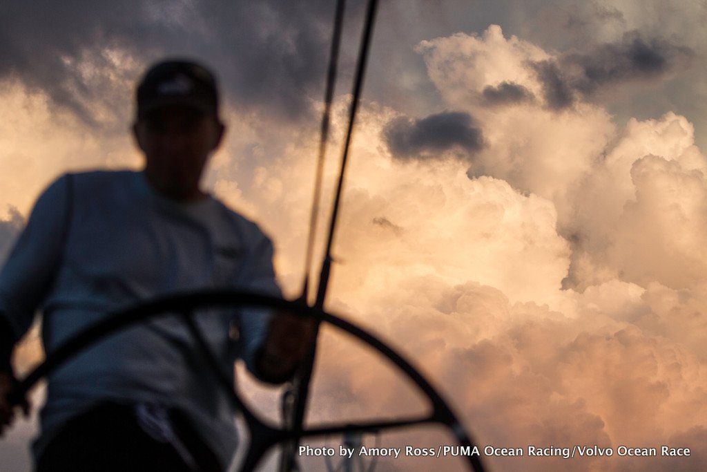 Kelvin Harrap drives under growing thunderclouds onboard MAR MOSTRO, skippered by Newport's Kenny Read.