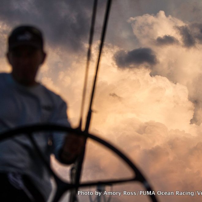 Kelvin Harrap drives under growing thunderclouds onboard MAR MOSTRO, skippered by Newport's Kenny Read.