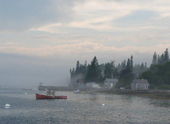 July fog rolls across Port Clyde Harbor.