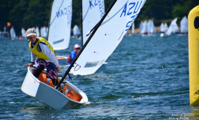 Day 2 of racing, southwest wind about 7 knots, a sailor rounds the first mark.