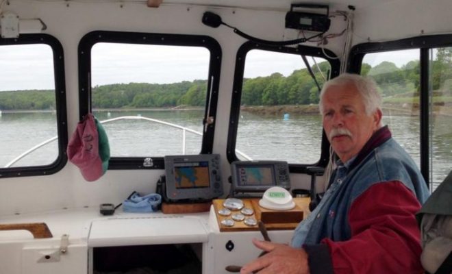 Like most boat owners, my friend Al Trescot seems most content at the helm, underway.