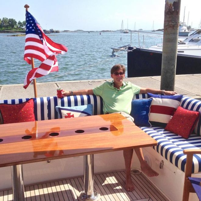 An owner's smile is the greatest award. Relaxing aboard a brand-new Eastbay 50, with designs by Onboard Interiors.