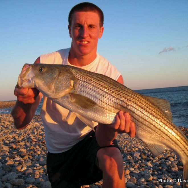 My son, Jon, with a nice 32-inch striper caught on a small swimmer.